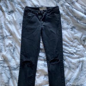 garage black jeans with knee rips
